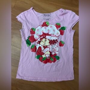 Strawberry Shortcake brand cotton shirt is manufactured by Isaac Morris Ltd